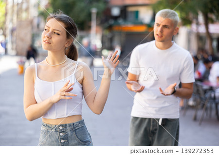 guy and his girlfriend quarreled on the street guy and his girlfriend quarreled on the street 139272353
