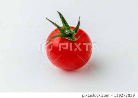 Product photo of one cherry tomato (white background, with space for copy). Product photo of one cherry tomato (white background, with space for copy). 139272829