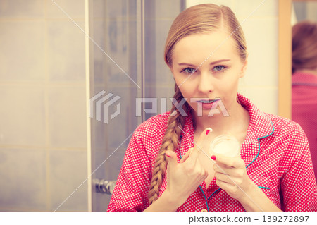 Woman applying moisturizing skin cream. Skincare. Woman applying moisturizing skin cream. Skincare. 139272897