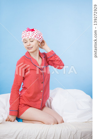 Funny woman wearing pajamas and bathing cap Funny woman wearing pajamas and bathing cap 139272929