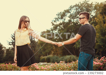 Cheerful girl holding hands in park. 139273002