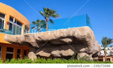 Balcony terrace made of rough stone with glass railing Balcony terrace made of rough stone with glass railing 139273086
