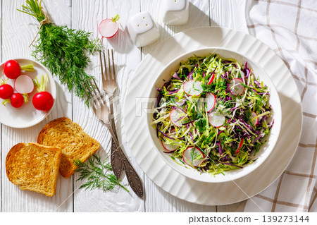 Fresh cabbage and radish coleslaw in white bowl Fresh cabbage and radish coleslaw in white bowl 139273144