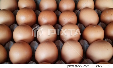 Close-up image of fresh chicken eggs in a cardboard tray. Close-up image of fresh chicken eggs in a cardboard tray. 139273559