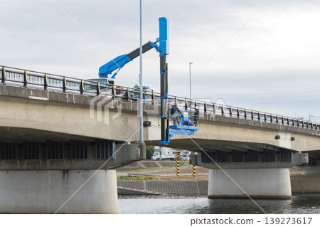 Bridge repair and inspection work carried out by bridge inspection vehicles. Bridge repair and inspection work carried out by bridge inspection vehicles. 139273617
