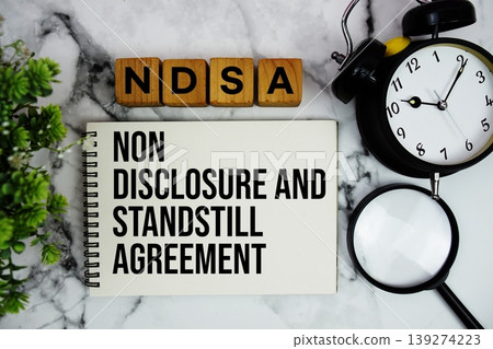 NDSA National Digital Stewardship Alliance text with alarm clock and magnifying glass on marble background 139274223