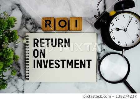 ROIC Return on Invested Capital text with alarm clock and magnifying glass on marble background ROIC Return on Invested Capital text with alarm clock and magnifying glass on marble background 139274237