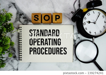 SOP Standard Operating Procedures text with alarm clock and magnifying glass on marble background SOP Standard Operating Procedures text with alarm clock and magnifying glass on marble background 139274241