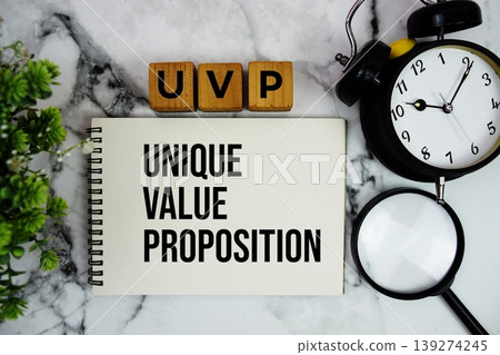 UVP Unique Value Proposition text with alarm clock and magnifying glass on marble background UVP Unique Value Proposition text with alarm clock and magnifying glass on marble background 139274245