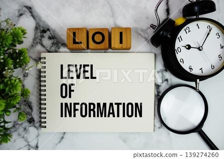 LOI Level of Information text with alarm clock and magnifying glass on marble background LOI Level of Information text with alarm clock and magnifying glass on marble background 139274260