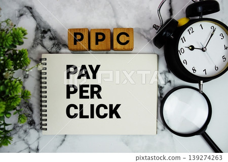 PPC Pay Per Click text with alarm clock and magnifying glass on marble background 139274263