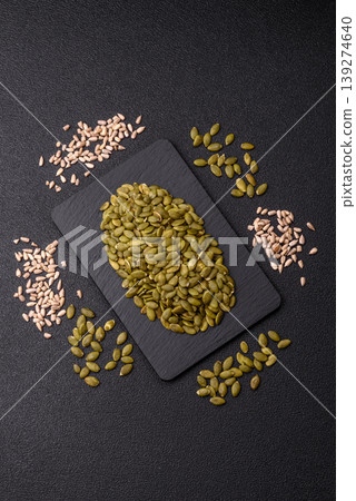 Shelled pumpkin seed kernels, salted, roasted, or raw, are a healthy ingredient. Pumpkin seeds Shelled pumpkin seed kernels, salted, roasted, or raw, are a healthy ingredient. Pumpkin seeds 139274640