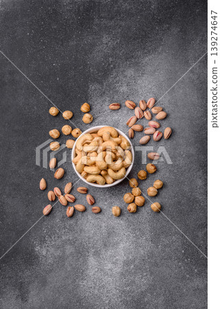 Roasted or raw cashew make a savory snack for a healthy, filling meal. Cashew nuts Roasted or raw cashew make a savory snack for a healthy, filling meal. Cashew nuts 139274647