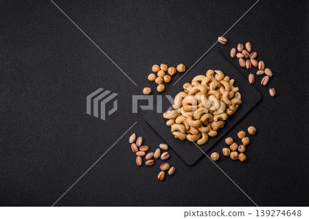 Roasted or raw cashew make a savory snack for a healthy, filling meal. Cashew nuts Roasted or raw cashew make a savory snack for a healthy, filling meal. Cashew nuts 139274648