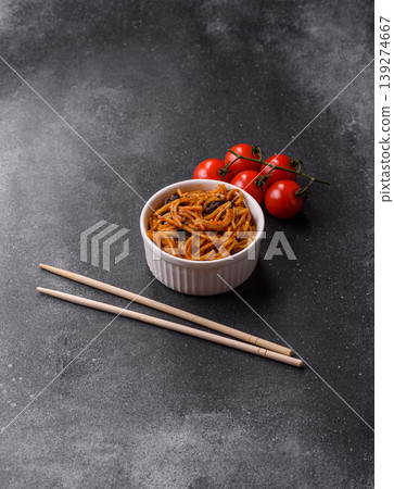 Yakisoba, Asian noodles with vegetables and meat, is a Japanese spicy food. Yakisoba or udon Yakisoba, Asian noodles with vegetables and meat, is a Japanese spicy food. Yakisoba or udon 139274667