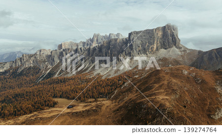 Pass near Cortina mountain. Aerial majestic view of popular place at autumn season, background Pass near Cortina mountain. Aerial majestic view of popular place at autumn season, background 139274764