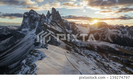 Bright sunlight is over horizon. Seceda mountain, aerial view of majestic nature, beautiful touristic place Bright sunlight is over horizon. Seceda mountain, aerial view of majestic nature, beautiful touristic place 139274797