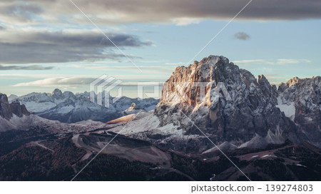 Far away, clouds in the sky, sunlight on the rocks. Seceda mountain, aerial view of majestic nature, beautiful touristic place Far away, clouds in the sky, sunlight on the rocks. Seceda mountain, aerial view of majestic nature, beautiful touristic place 139274803