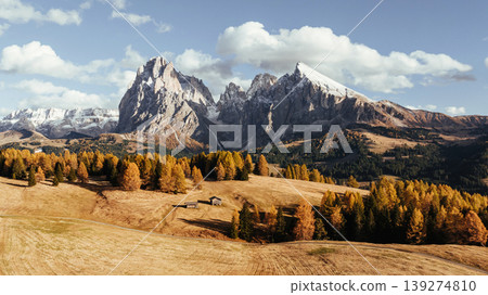 Place to live peaceful life, wooden houses. Alpe di Siusi, Seiser Alm, aerial view of majestic dolomites, mountains background Place to live peaceful life, wooden houses. Alpe di Siusi, Seiser Alm, aerial view of majestic dolomites, mountains background 139274810