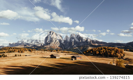 Place to live peaceful life, wooden houses. Alpe di Siusi, Seiser Alm, aerial view of majestic dolomites, mountains background Place to live peaceful life, wooden houses. Alpe di Siusi, Seiser Alm, aerial view of majestic dolomites, mountains background 139274815