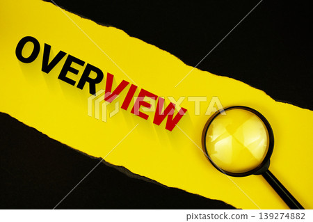 Overview text on yellow with black paper torn ripped and magnifying glass Overview text on yellow with black paper torn ripped and magnifying glass 139274882