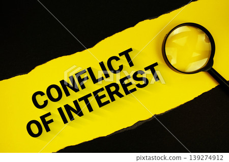Conflict Of Interest text on yellow with black paper torn ripped and magnifying glass Conflict Of Interest text on yellow with black paper torn ripped and magnifying glass 139274912