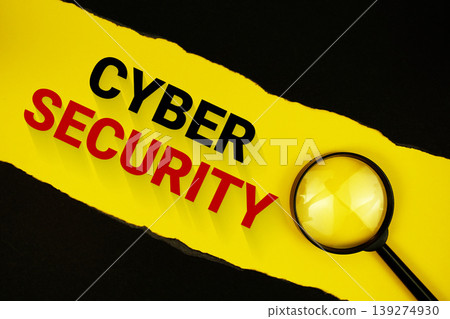 Cyber Security text on yellow with black paper torn ripped and magnifying glass Cyber Security text on yellow with black paper torn ripped and magnifying glass 139274930