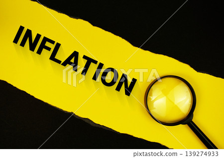 Inflation text on yellow with black paper torn ripped and magnifying glass Inflation text on yellow with black paper torn ripped and magnifying glass 139274933