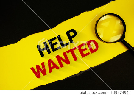 Help Wanted text on yellow with black paper torn ripped and magnifying glass Help Wanted text on yellow with black paper torn ripped and magnifying glass 139274941