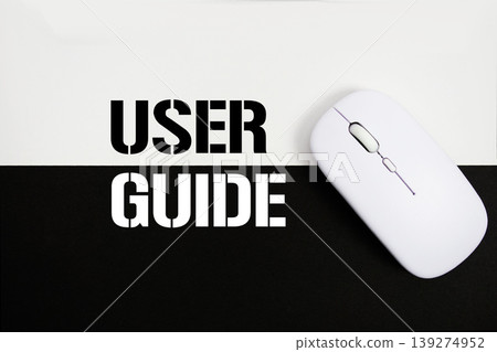 User Guide text and wireless mouse on white and black background User Guide text and wireless mouse on white and black background 139274952