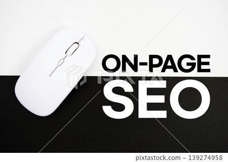 On-Page SEO text and wireless mouse on white and black background 139274958