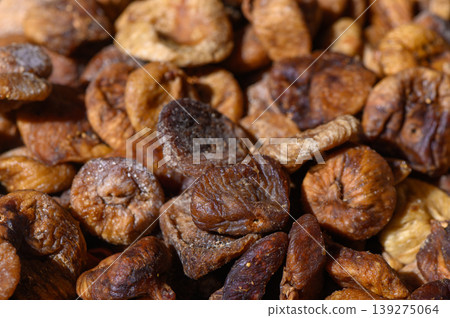 Dried figs showcasing natural sweetness and rich textures at a local market during early afternoon Dried figs showcasing natural sweetness and rich textures at a local market during early afternoon 139275064