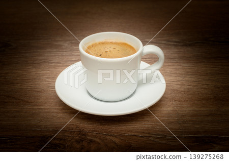 Side view of Turkish coffee with creamy foam in cup Side view of Turkish coffee with creamy foam in cup 139275268