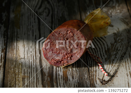 Handcrafted artisan meat resting on rustic wooden surface, inviting culinary exploration at twilight Handcrafted artisan meat resting on rustic wooden surface, inviting culinary exploration at twilight 139275272
