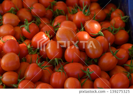 Freshly harvested cherry tomatoes displayed at a local farmers market during a sunny afternoon in early summer 139275325