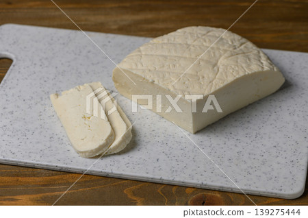 Fresh Sulguni Cheese on Rustic Kitchen Table Fresh Sulguni Cheese on Rustic Kitchen Table 139275444