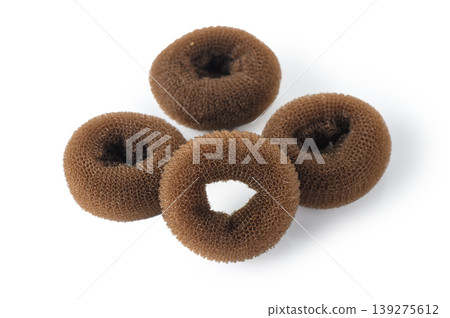 Set of 4 brown donut hair sponges for voluminous buns on white Set of 4 brown donut hair sponges for voluminous buns on white 139275612