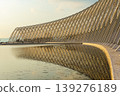 Calatrava roof arches reflection in water at Olympic Complex Athens Greece. 139276189