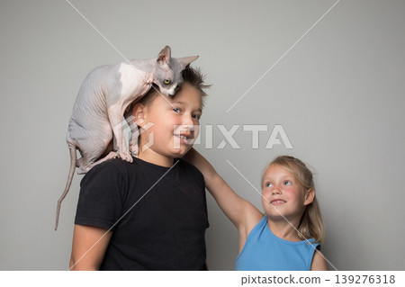 Children with funny cat pet Children with funny cat pet 139276318