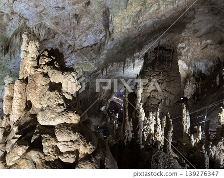 Mysterious stalactites and stalagmites in cave. Geology formation undeground background 139276347