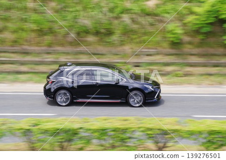 Panning shot of a car: Side view of a Toyota Corolla Sport Panning shot of a car: Side view of a Toyota Corolla Sport 139276501
