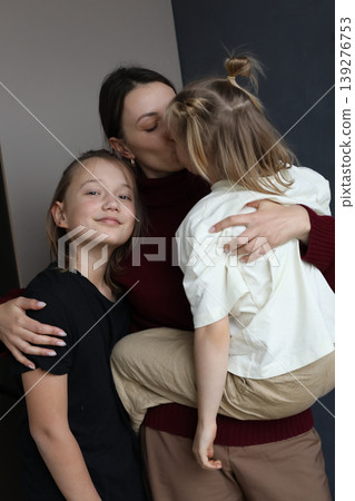 Happy family indoor portrait. Mother, son and daughter. Happy family indoor portrait. Mother, son and daughter. 139276753