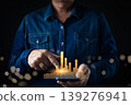 A businessman using a smartphone with a glowing holographic bar chart, representing business growth, data analytics, financial success, and digital marketing performance in modern technology. 139276941