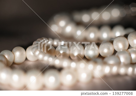 Pearl necklace strands on soft gray background, bridal elegance concept. 139277008