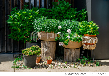 Many different pots with flowers standing on the street to decorate the terrace Many different pots with flowers standing on the street to decorate the terrace 139277243