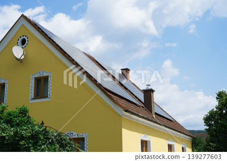 Side view of solar panels installed on the roof of a private house Side view of solar panels installed on the roof of a private house 139277603