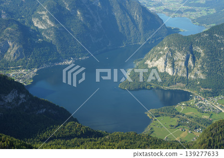 Impressive view of an alpine valley with a lake from the top of a mountain Impressive view of an alpine valley with a lake from the top of a mountain 139277633