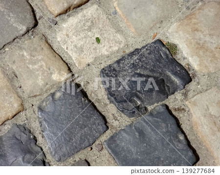 Pavement Surface Showing Blocks and Stones in a Causeway Area During a Sunny Day Pavement Surface Showing Blocks and Stones in a Causeway Area During a Sunny Day 139277684