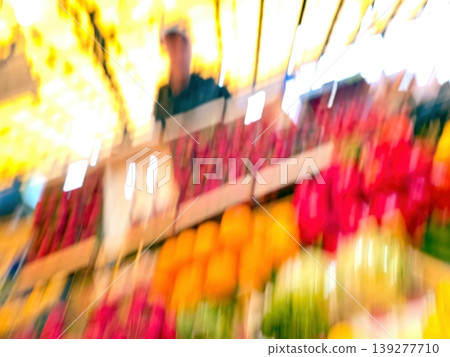 Colorful Display of Fruits and Vegetables at a Busy Market Stall in the Afternoon 139277710