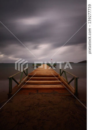 Old abandoned wooden fishing pier on the river in the countryside Old abandoned wooden fishing pier on the river in the countryside 139277739
